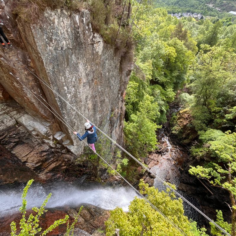 a waterfall with trees in the background