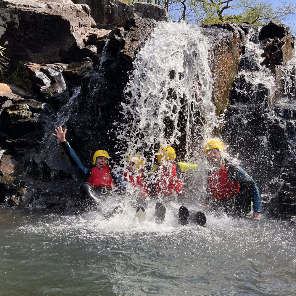 a group of people on a raft in the water